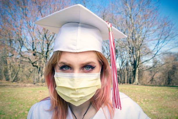 istock Female Graduate in Face Mask Coronavirus Era 1215002324