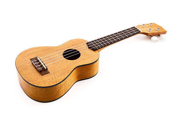 ukulele auf weißem hintergrund - ukulele stock-fotos und bilder