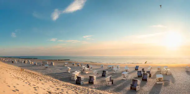 Photo of Beach scenery at sunset at North Sea. Beach chairs at Red Cliff, Sylt island