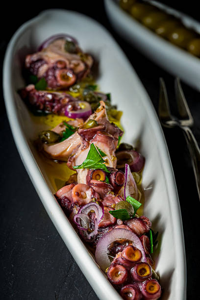 istock Octopus carpaccio in serving dish. 1215006223