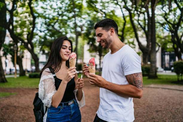 istock Happy couple sharing ice cream 1215006312