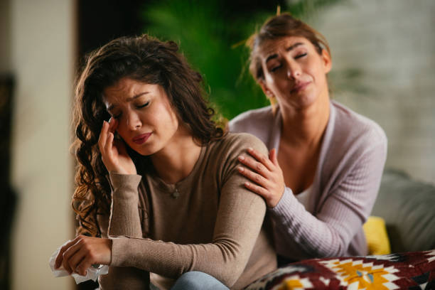 istock Woman crying. Sister is comforting her. 1215007549