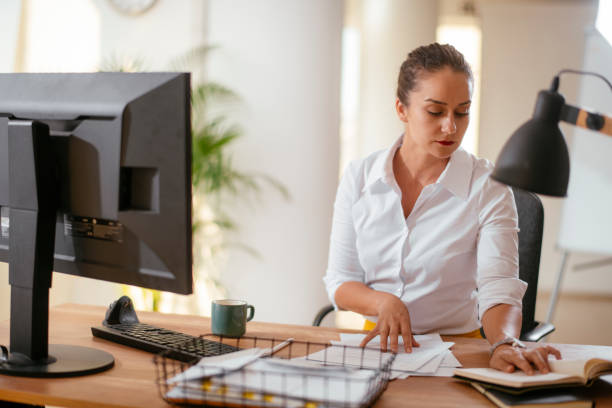 istock Business woman working on the computer in the office. 1215008965