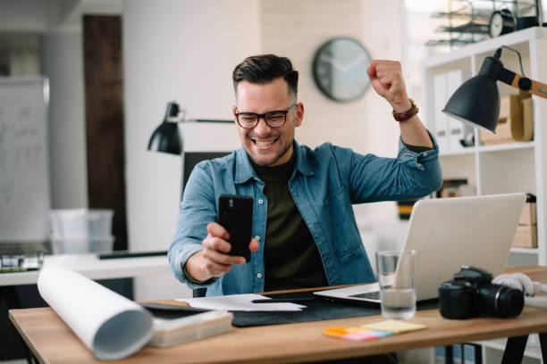 istock Happy businessman in office. 1215009177