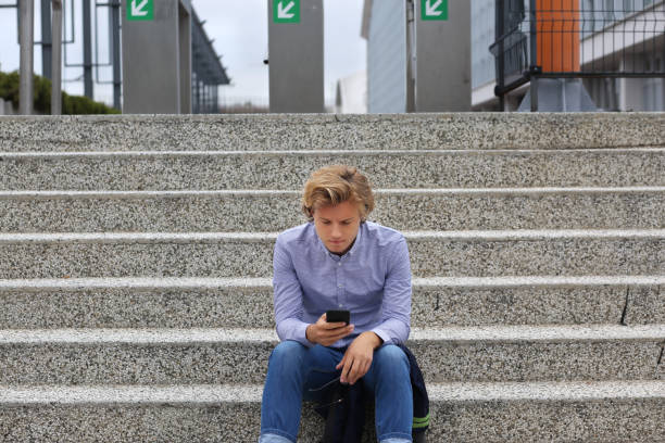 istock Teenage boy typing text message.Using smart phone. 1215010214