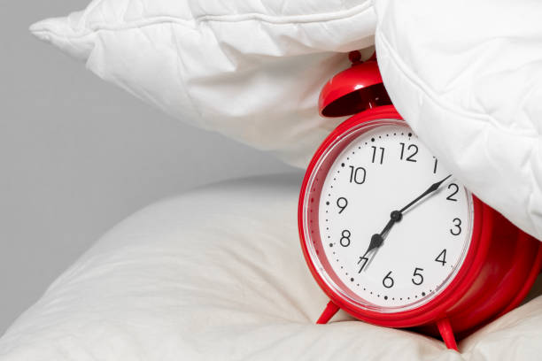 istock Alarm clock under the pillow - Don't want to wake up concept 1215010449