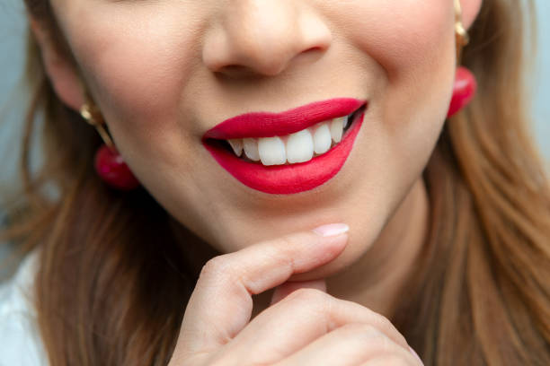 istock Happy young woman with red lips 1215013841