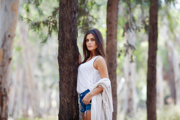 istock Beautiful woman walking on nature walk in forest 1215014194