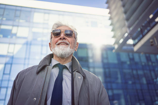 istock Cheerful modern senior businessman with sunglasses 1215015205