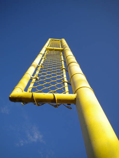 istock Yellow sports goal post against a blue sky 1215016100