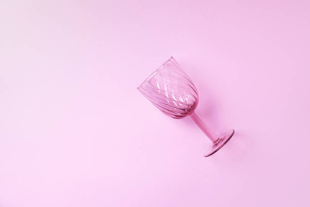 istock Champagne glass on pink background with copy space for text. Top view. Holiday and celebration concept. 1215016169