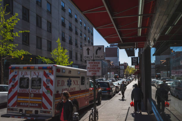 Flushing, New York City - April 24, 2019: Pedestrians walking down street in Flushing Chinatown