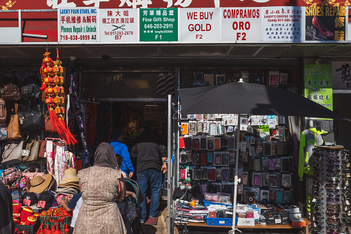 Flushing, New York City - April 24, 2019: People entering store in Flushing Chinatown