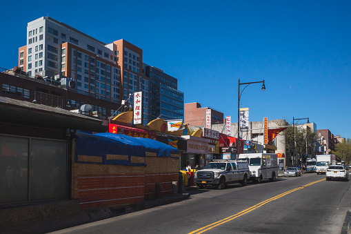 Flushing, New York City - April 24, 2019: Traffic and construction on Roosevelt Ave in Flushing Chinatown