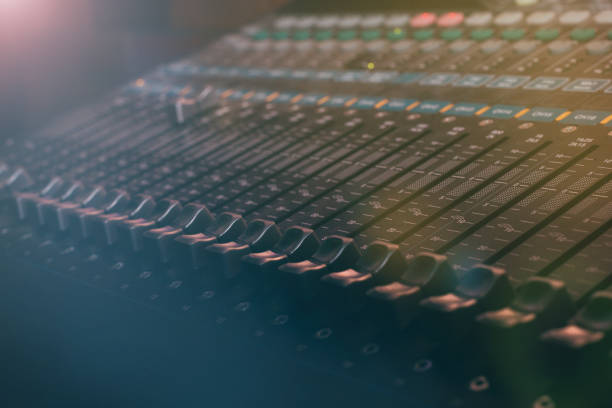 istock Professional audio and sound mixer control panel with buttons sliders and faders 1215017517