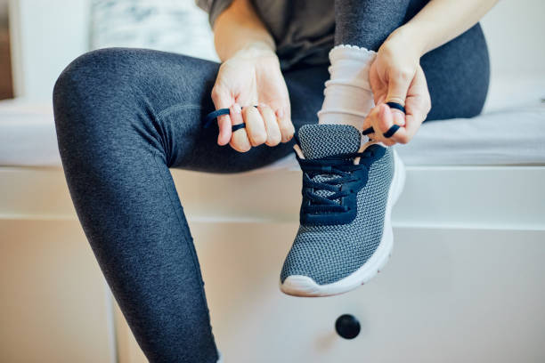 istock Cute girl preparing for workout at home. 1215017542