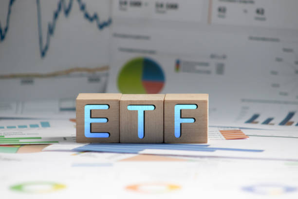 ETF or Exchange Traded Fund text on black block stock photo