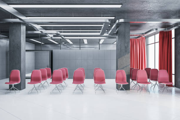 istock Interior of a presentation room with red chairs 1215021330