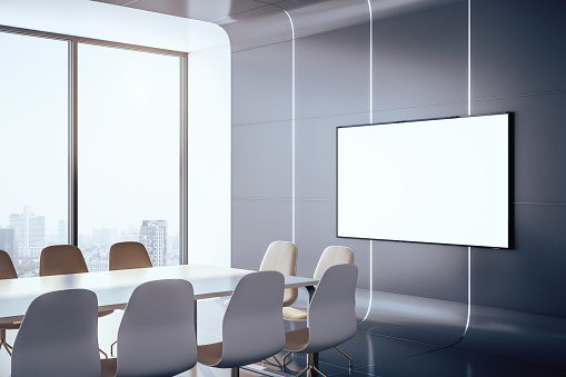 Contemporary futuristic conference interior room with blank plasma on wall and city view. Presentation concept. 3D Rendering