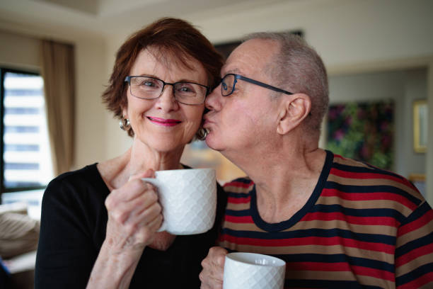 istock Husband kissing his wife 1215023283