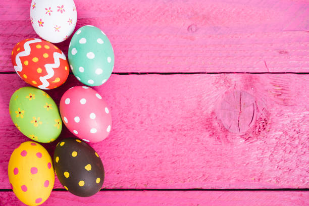 istock Easter eggs top view on pink wooden background and have copy space for use 1215024117