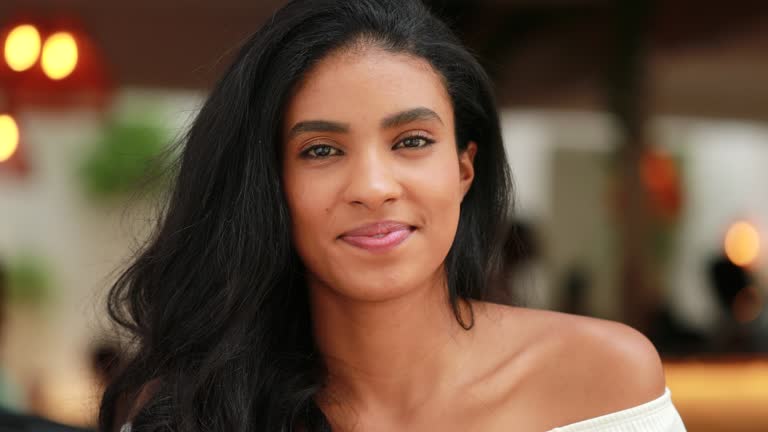 Pretty black african american young woman smiling to camera