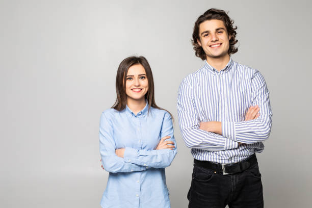 istock Happy smiling young couple over white background. 1215027348