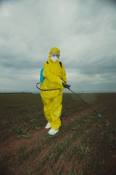 istock Worker spraying toxic pesticides 1215028020