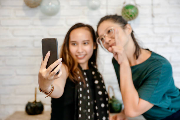 istock Female tourists have fun taking selfie 1215028080