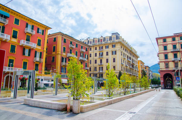La Spezia, Italy, September 13, 2018: alley with modern mirror arches with reflection by Daniel Buren on Piazza Giuseppe Verdi square among buildings in historical city centre, Liguria