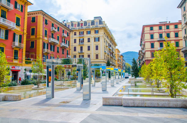 La Spezia, Italy, September 13, 2018: alley with modern mirror arches with reflection by Daniel Buren on Piazza Giuseppe Verdi square among buildings in historical city centre, Liguria