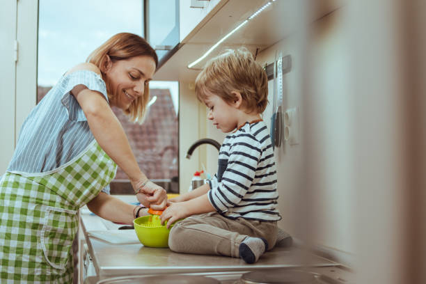istock Mom and son making juice 1215030210