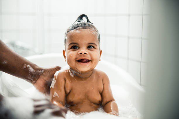 istock Adorable Afro American toddler taking bath and smiling 1215033561