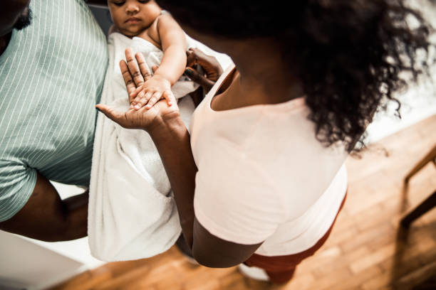 istock Loving parents spending time with cute newborn daughter 1215034025
