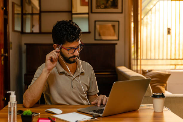 istock Beautiful Latin model using video conference call during remote work. Home office concept 1215034197