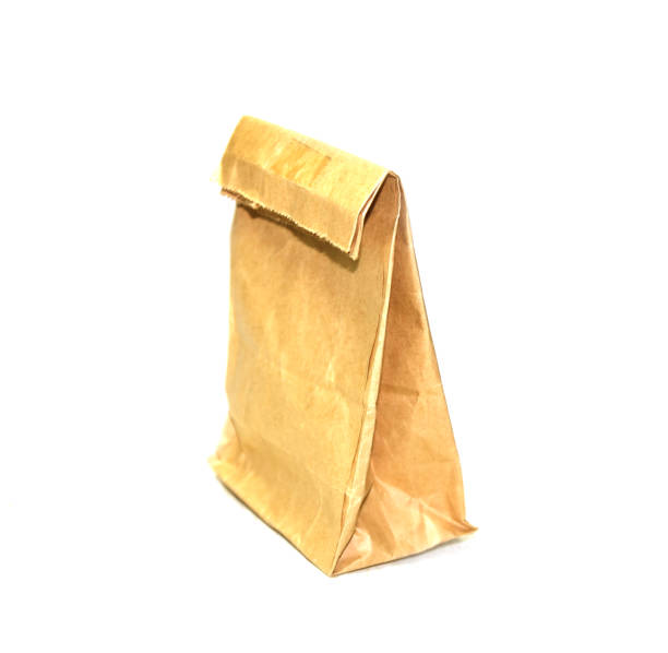 istock Brown paper bag isolated on white background with clipping path 1215038498