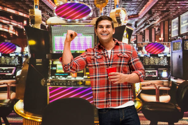 caucasian young male standing wearing shirt - smiling casino human hand beautiful imagens e fotografias de stock