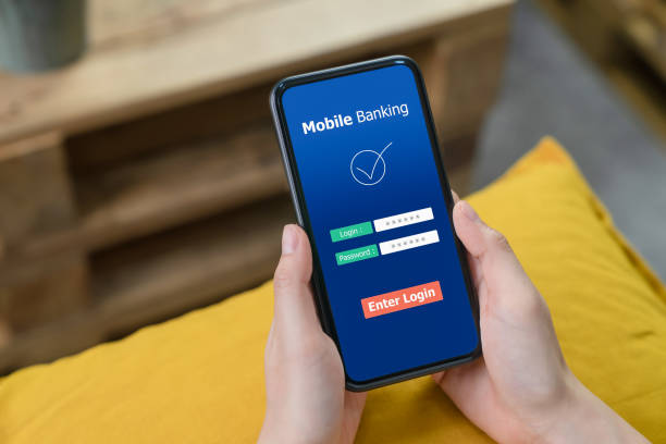 istock Female hands using mobile banking on smartphone and enter password to login application. 1215047333