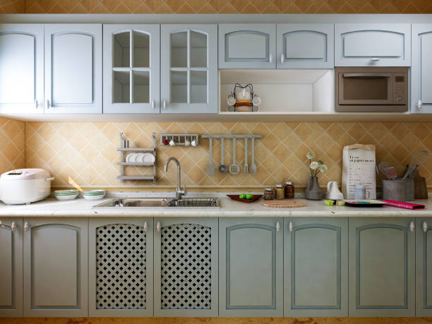 istock 3D rendering, Mediterranean-style kitchen design, brand new cabinets and kitchenware with refrigerator, sunlight comes in through the window. 1215049210