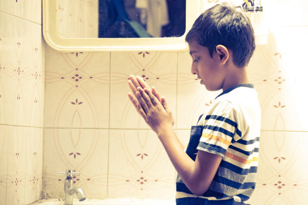 istock boy washing hand at home 1215050344