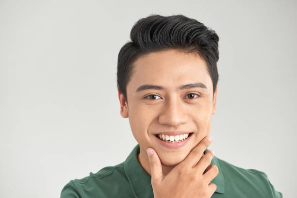 istock Image of handsome cheerful mature man standing isolated over grey wall background 1215054775