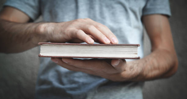 istock Caucasian man holding bible. Religion 1215059741