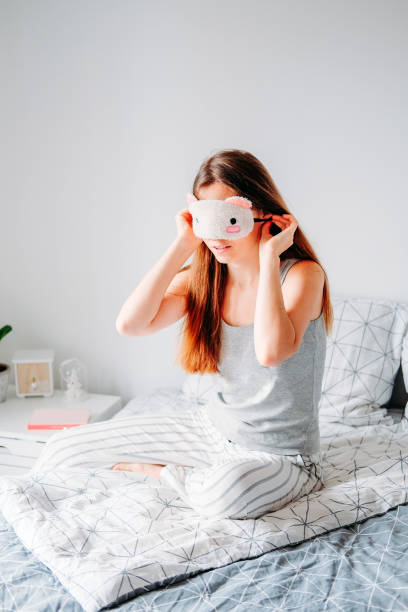 istock Woman in sleeping mask getting ready for the day 1215063352