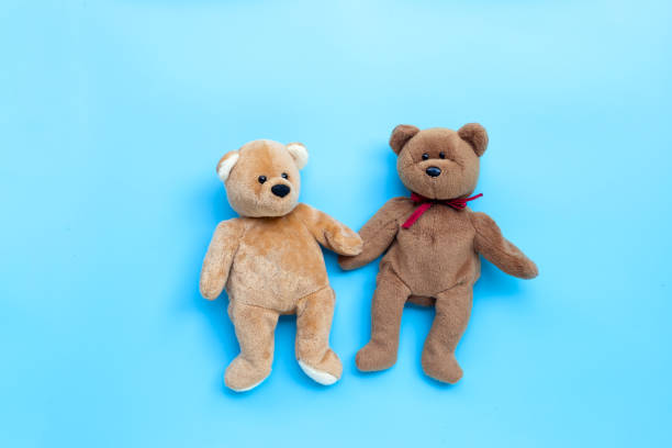 istock Bear toy couple on blue background. 1215063380
