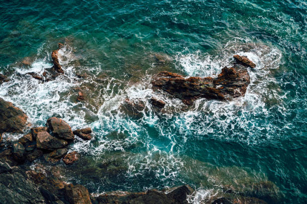 istock Sea waves crashing against the rocky beach. 1215064135