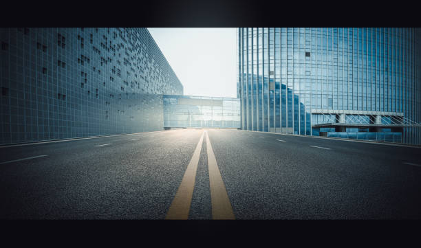 istock Divided highway passing through city buildings, blue nostalgia high contrast 1215065882