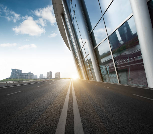 istock Divided highway passing through city buildings, blue nostalgia high contrast 1215065912
