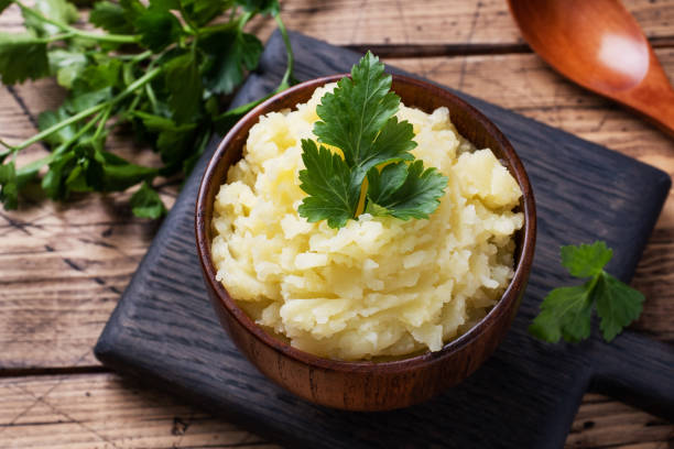 istock Homemade cream mashed potatoes in a dish with parsley. 1215066210