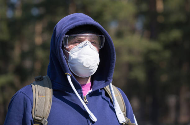 istock A man wears a mask and glasses during quarantine. 1215068429