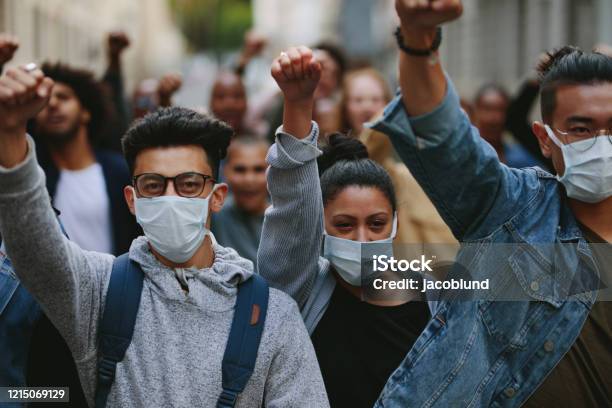 Group Of Demonstrators Protesting In The City Stock Photo - Download Image Now - Protest, Mask - Disguise, Human Rights